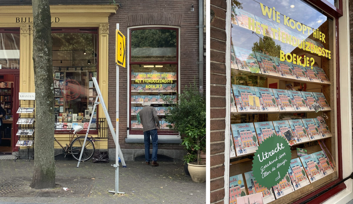 'Wie koopt het tienduizendste boek?'  Het staat in een etalage in Bijleveld.  Foto: Brigitte Nieubuur